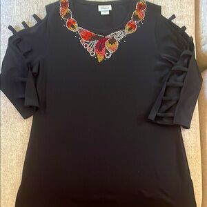 Black top with unique rhinestone embellishments